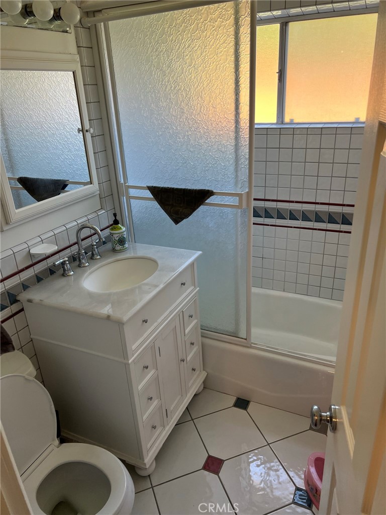 2256 Rutgers Drive Costa Mesa, CA 92626 - Photo 11 of 11 a bathroom with a sink toilet and shower