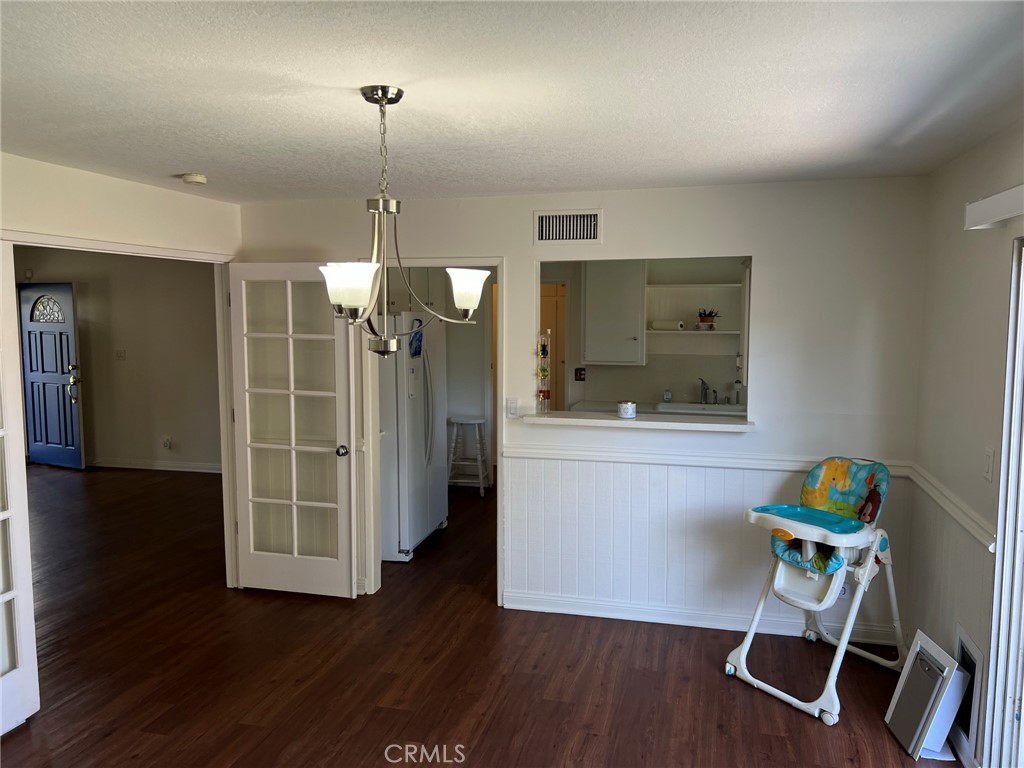 2256 Rutgers Drive Costa Mesa, CA 92626 - Photo 5 of 11 a view of a room with wooden floor wooden floor and windows