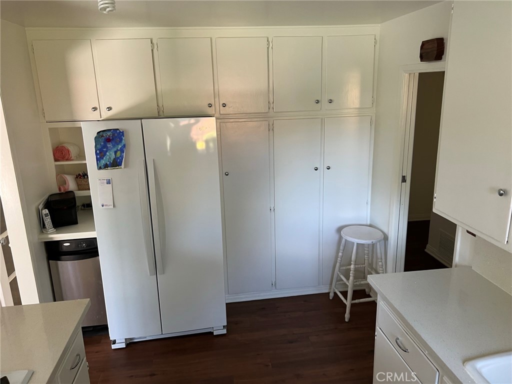 2256 Rutgers Drive Costa Mesa, CA 92626 - Photo 6 of 11 a view of kitchen with refrigerator and wooden floor