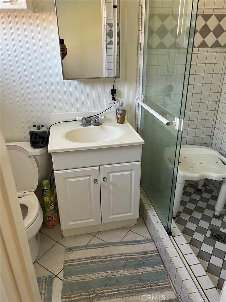 2256 Rutgers Drive Costa Mesa, CA 92626 - Photo 8 of 11 a bathroom with a sink toilet and shower