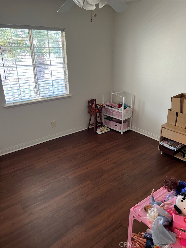 2256 Rutgers Drive Costa Mesa, CA 92626 - Photo 10 of 11 a room with wooden floor and a window