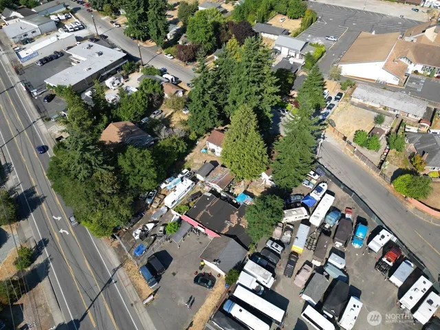 an aerial view of a house with a yard and garden