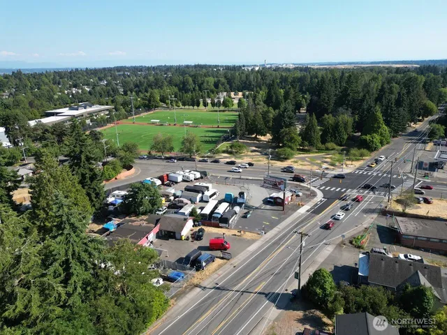 an aerial view of multiple houses with yard
