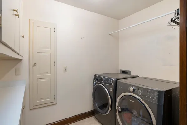 an aerial view of a house with garden space and street view