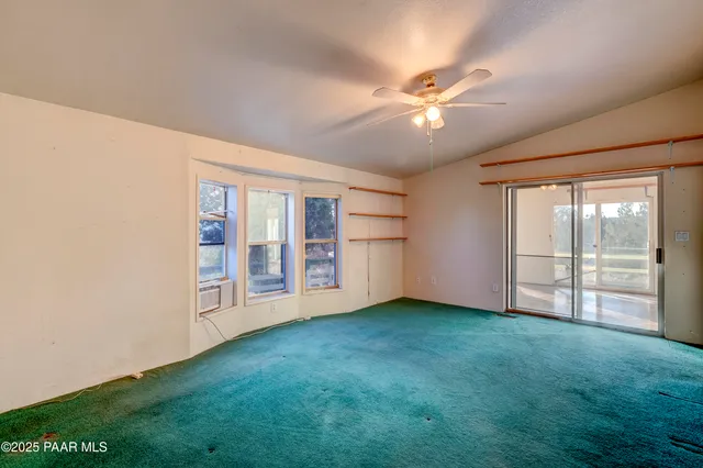 a spacious bathroom with a double vanity sink a mirror and bathtub