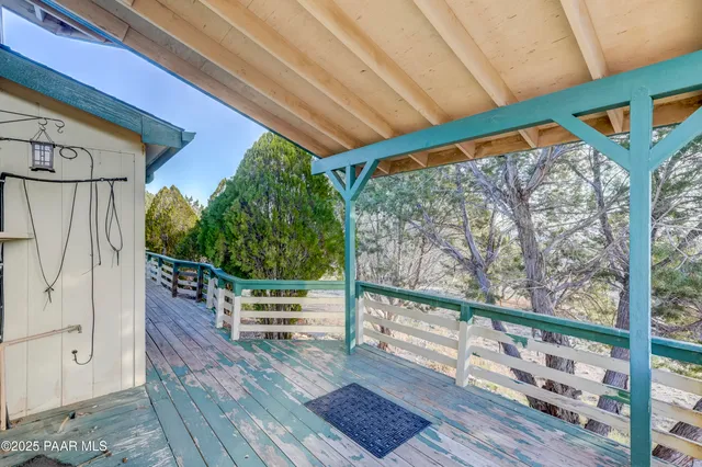 an aerial view of a house with yard