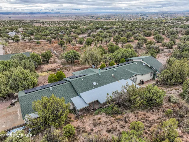 an aerial view of a house with a garden