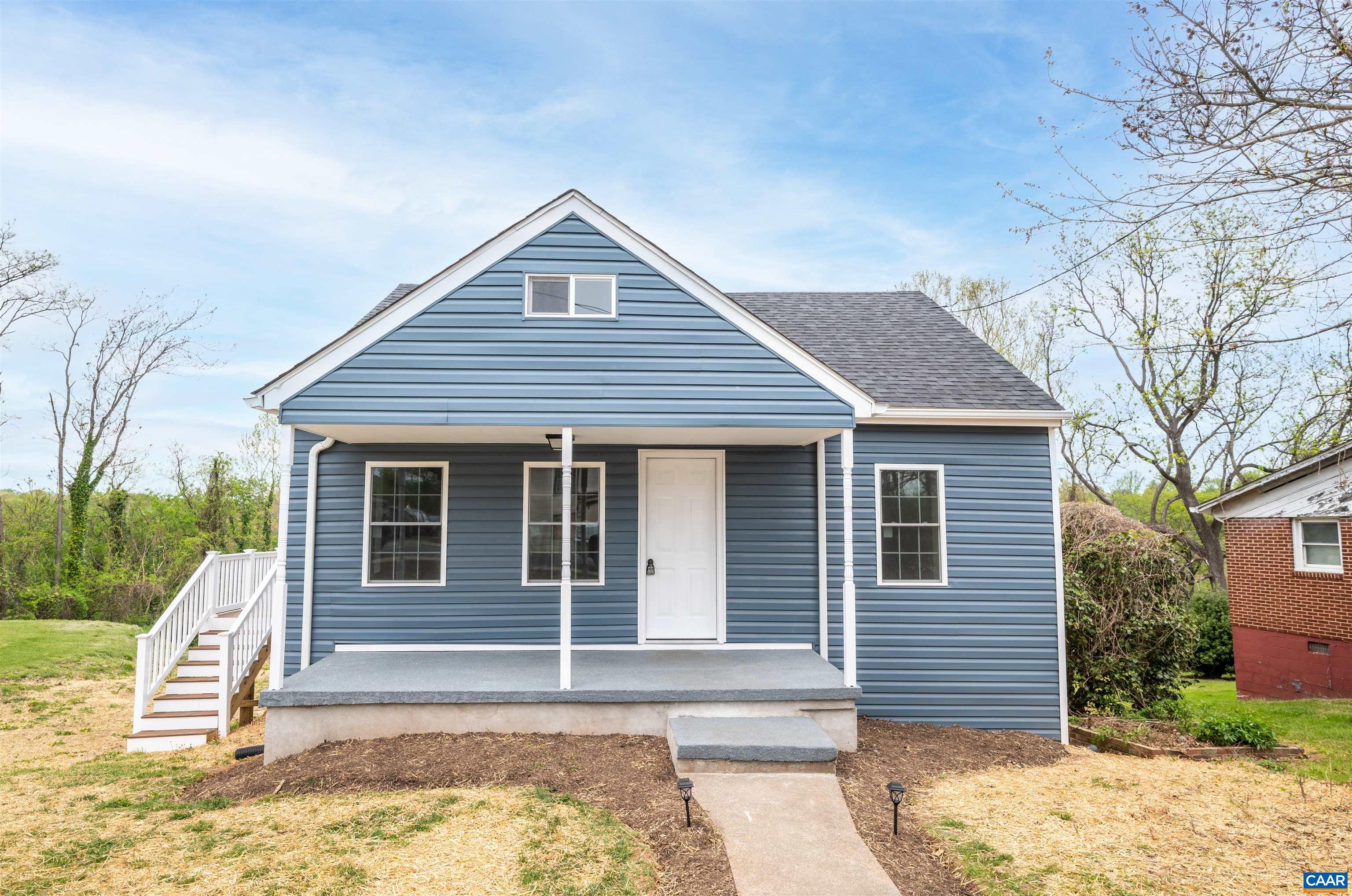 839 Ridge Street Charlottesville, VA 22902 - Photo 1 of 26 a front view of a house with a yard