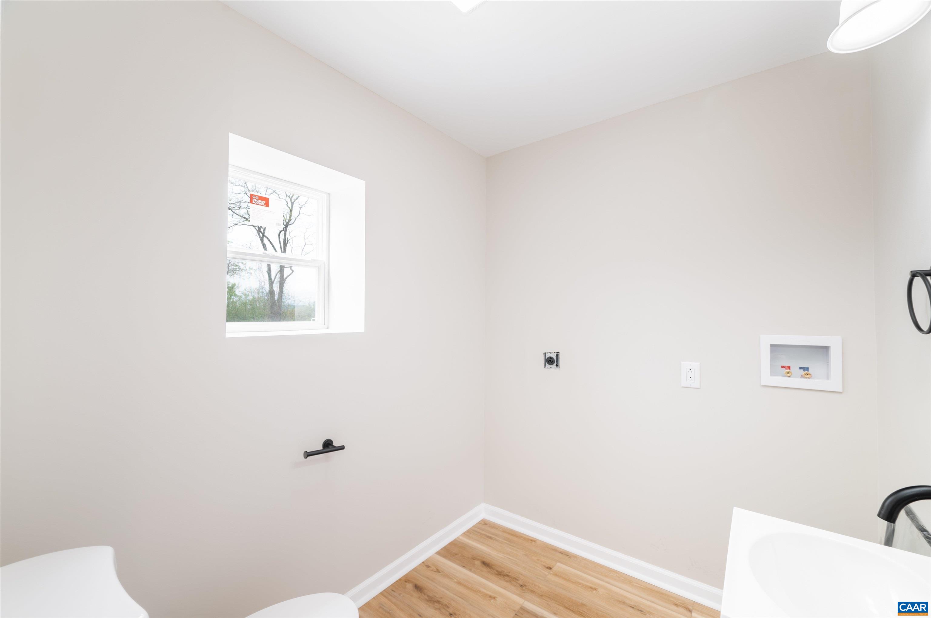839 Ridge Street Charlottesville, VA 22902 - Photo 14 of 26 a view of a room with wooden floor and bathroom