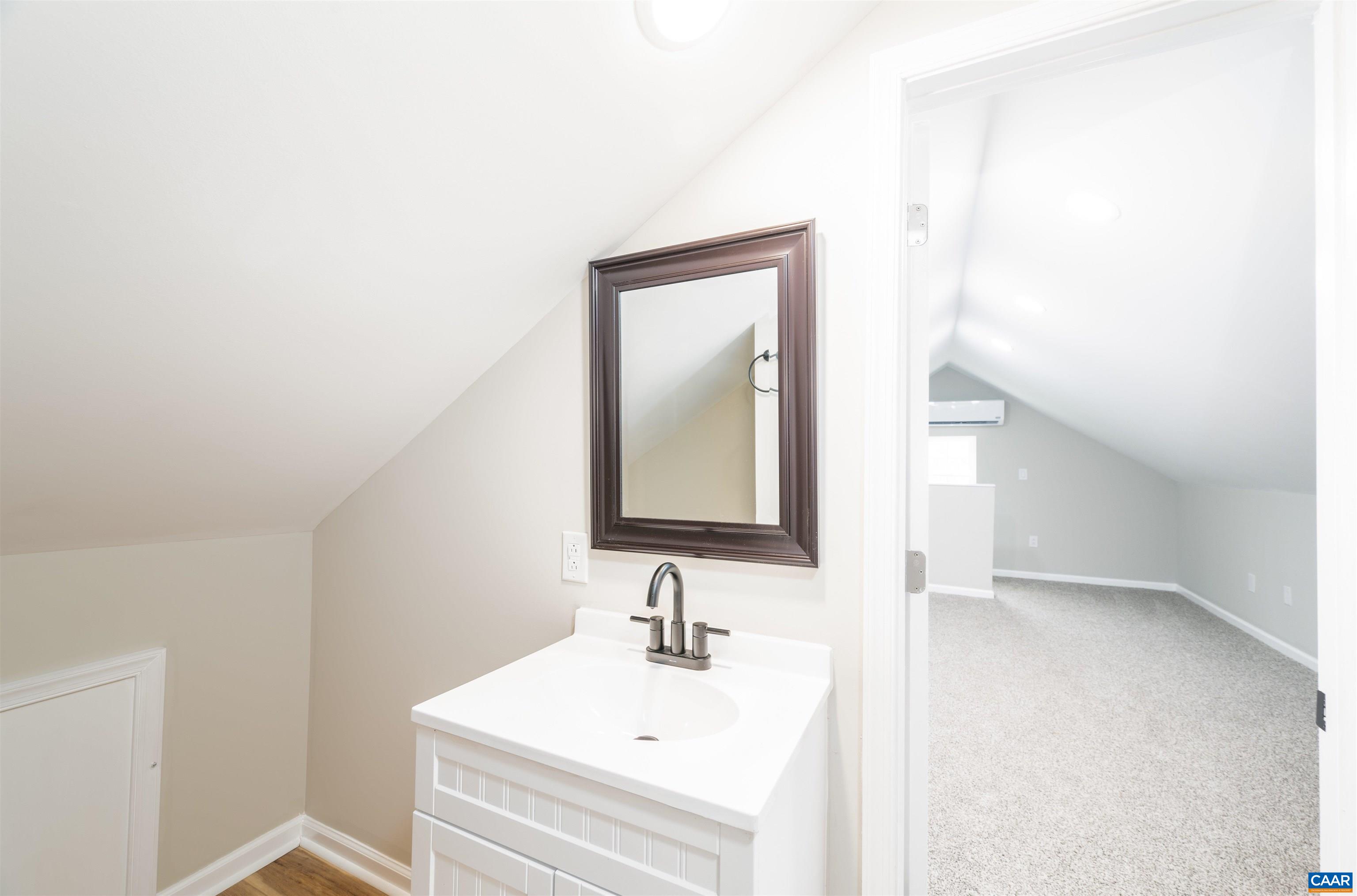 839 Ridge Street Charlottesville, VA 22902 - Photo 18 of 26 a bathroom with a sink and a mirror
