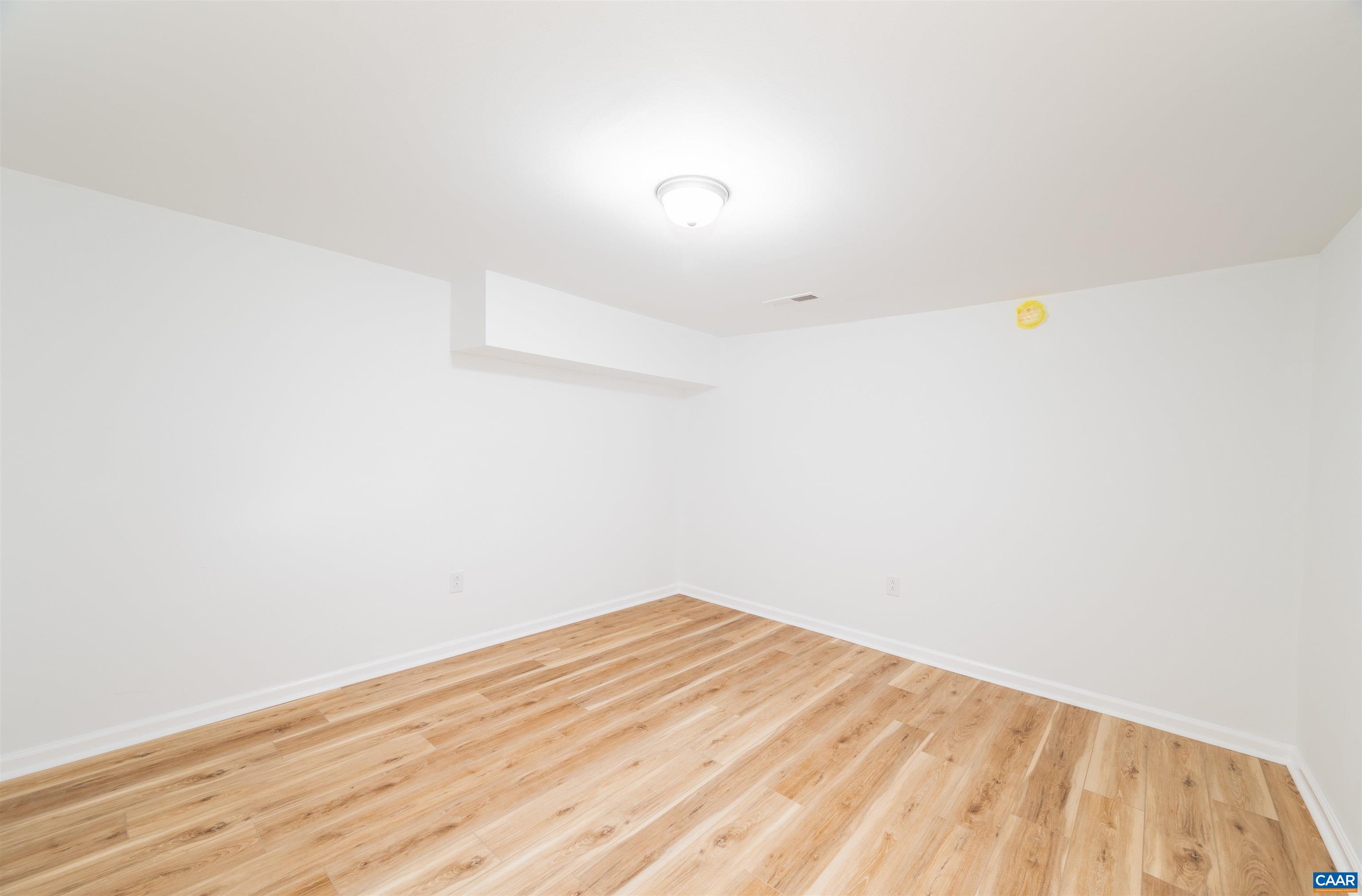 839 Ridge Street Charlottesville, VA 22902 - Photo 24 of 26 a view of empty room with wooden floor