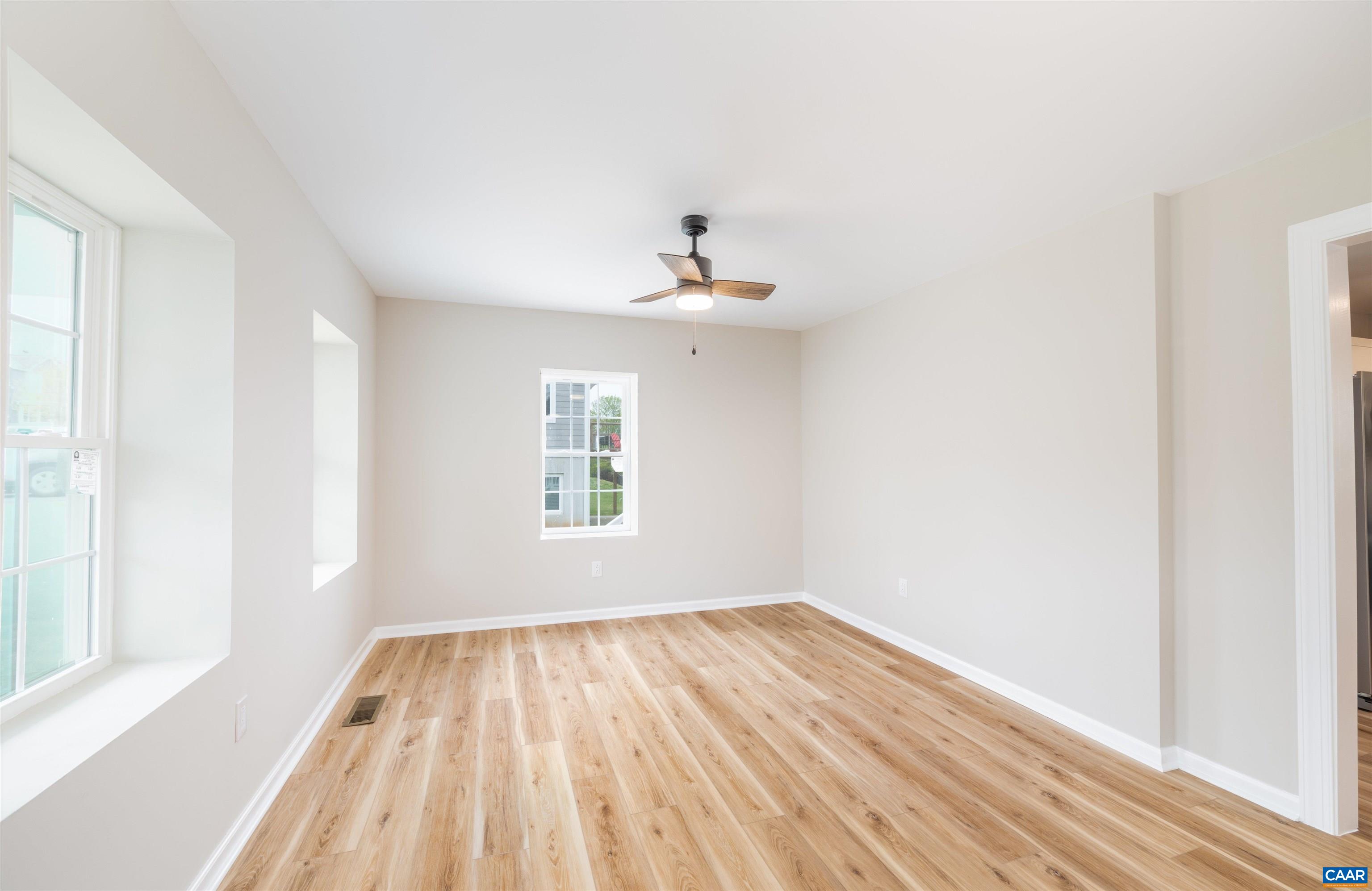839 Ridge Street Charlottesville, VA 22902 - Photo 5 of 26 a view of a room with wooden floor and a window