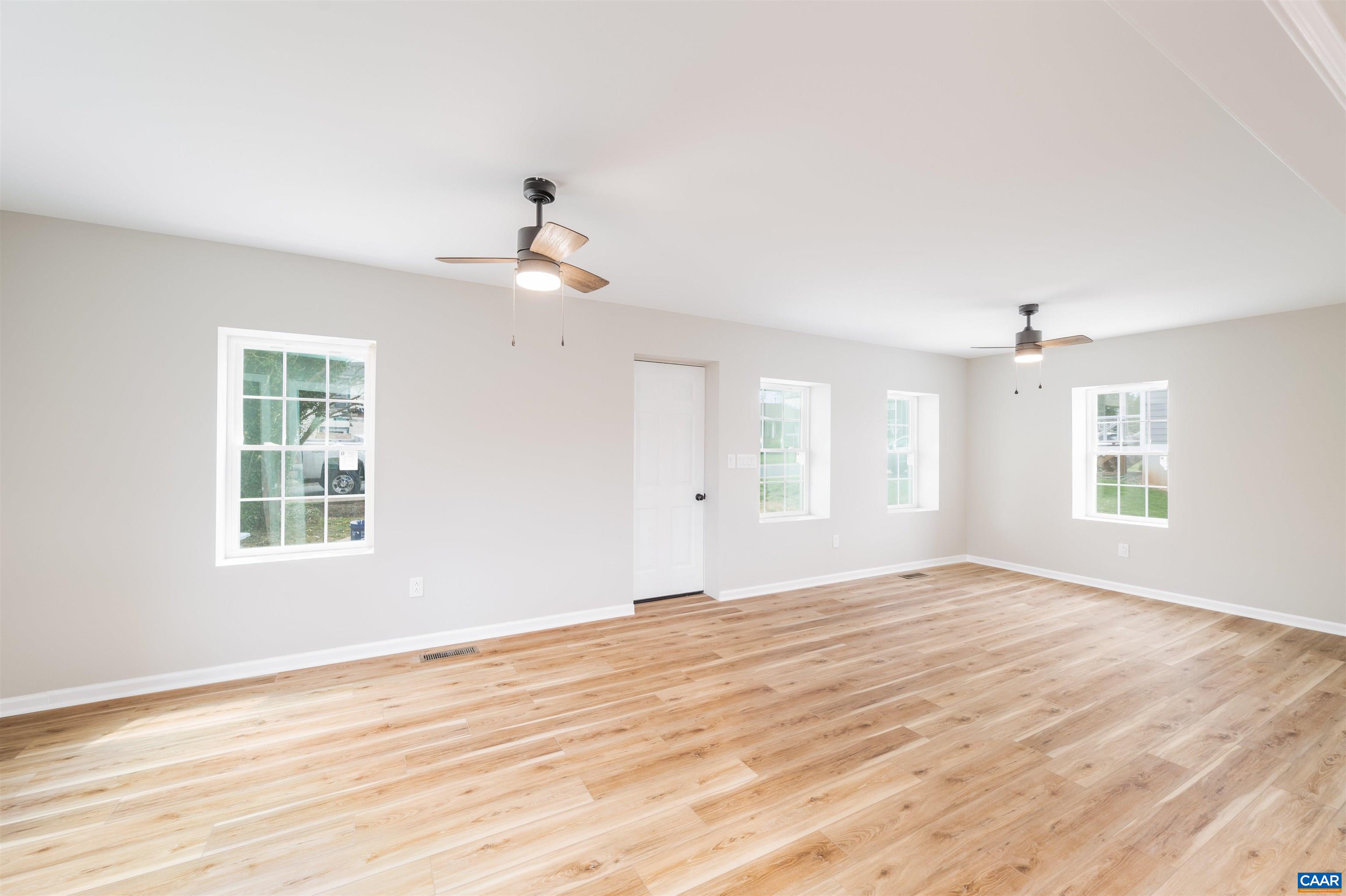 839 Ridge Street Charlottesville, VA 22902 - Photo 8 of 26 a view of an empty room with wooden floor and a window