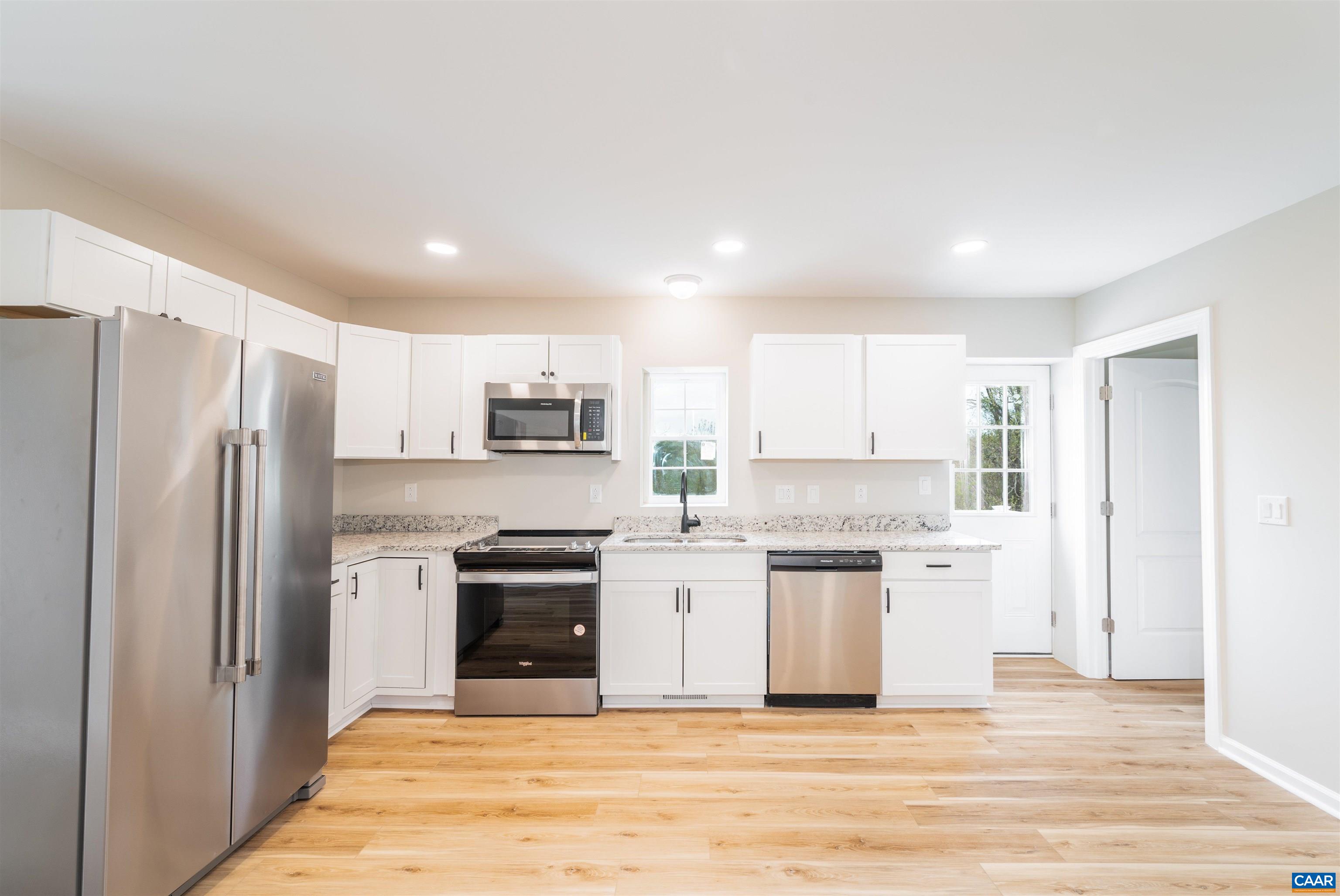 839 Ridge Street Charlottesville, VA 22902 - Photo 9 of 26 a kitchen with stainless steel appliances a stove a refrigerator and a refrigerator