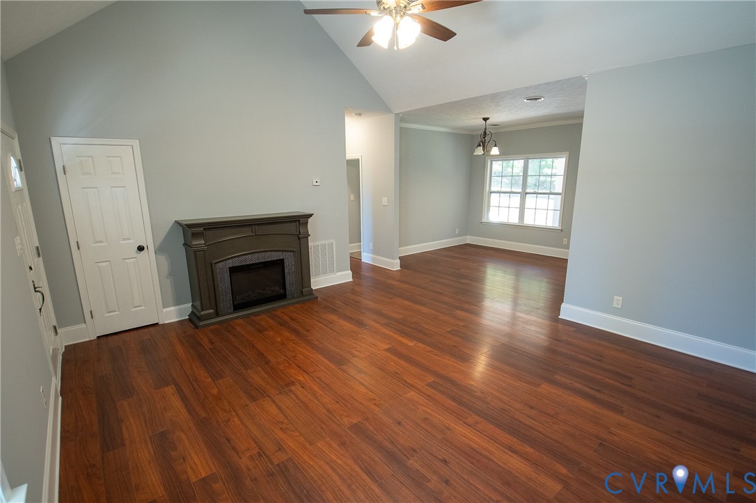 7491 Richmond Road Amelia Court House, VA 23002 - Photo 12 of 39 wooden floor fireplace and natural light in room