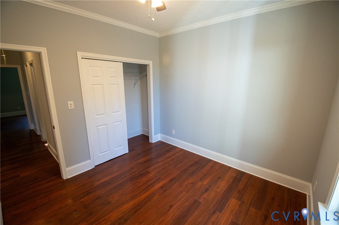 7491 Richmond Road Amelia Court House, VA 23002 - Photo 20 of 39 an empty room with wooden floor and closet