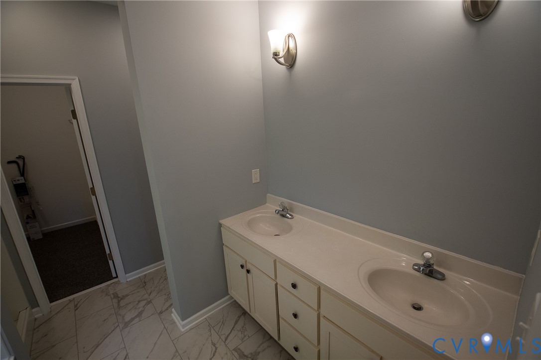 7491 Richmond Road Amelia Court House, VA 23002 - Photo 25 of 39 a bathroom with a sink and mirror