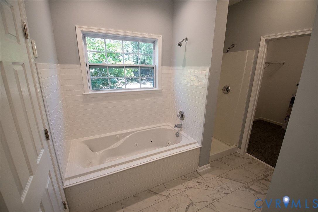 7491 Richmond Road Amelia Court House, VA 23002 - Photo 26 of 39 a white bath tub sitting next to a window