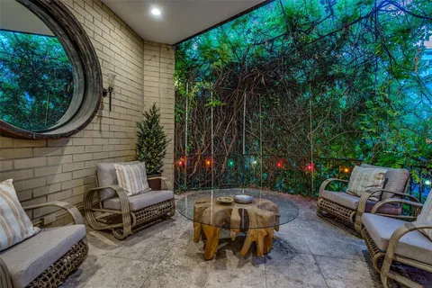 a backyard of a house with outdoor seating and green space