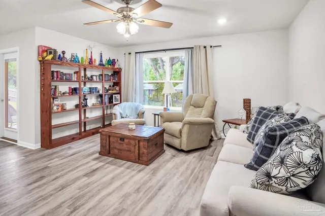 a living room with furniture and a window