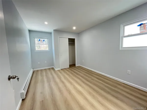 a view of an empty room and a window