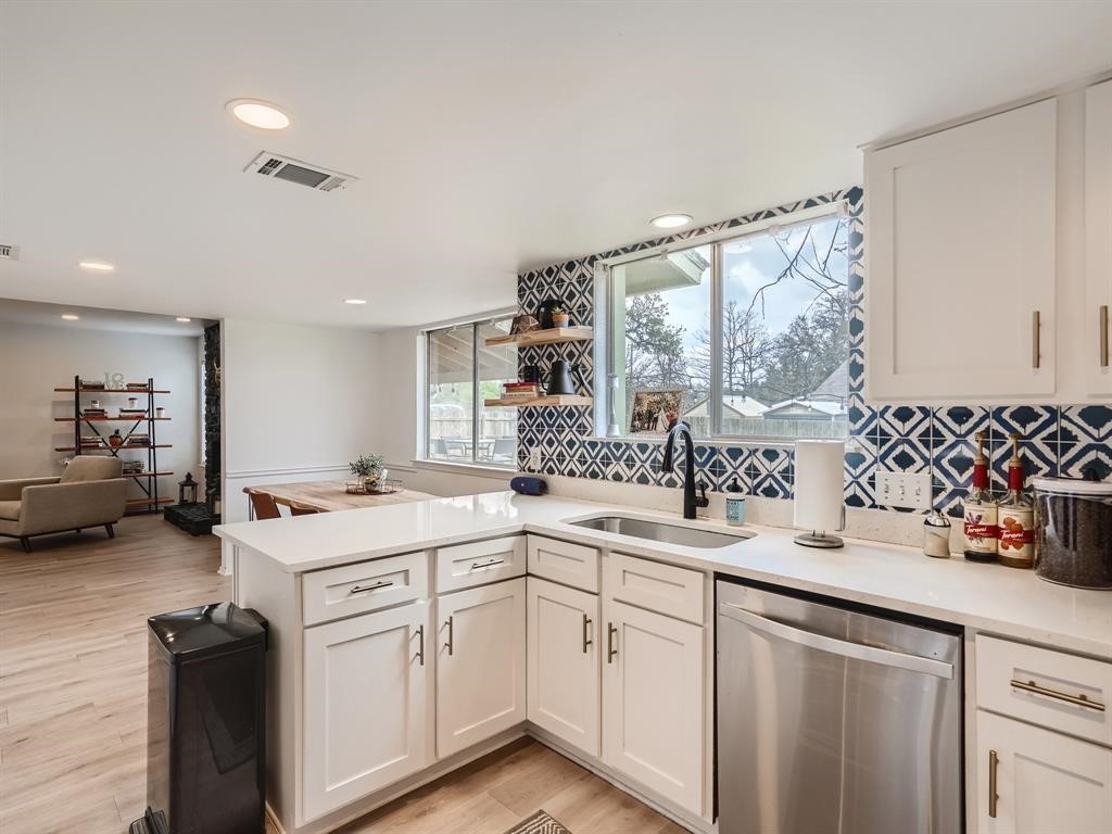 7701 Copano Drive Austin, TX 78749 - Photo 14 of 27 a kitchen with a sink stove and cabinets