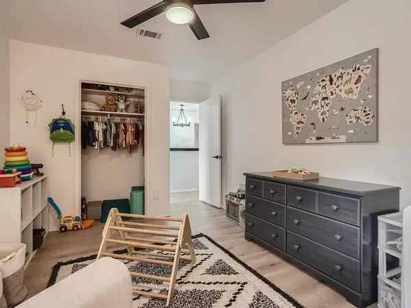 a bedroom with a bed and furniture