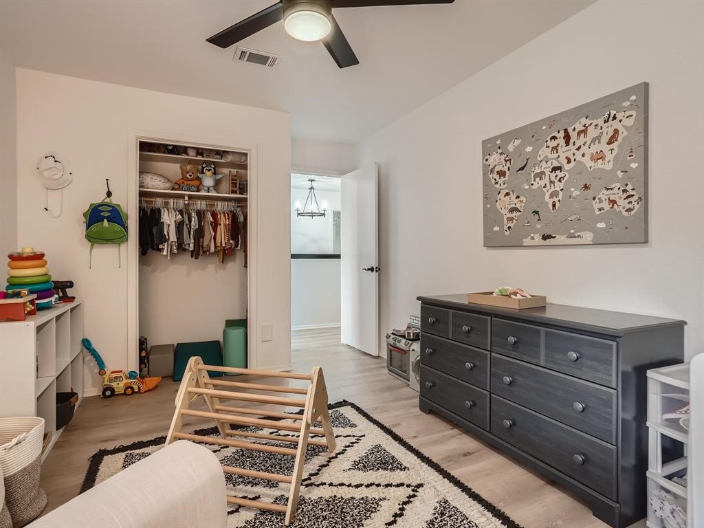 7701 Copano Drive Austin, TX 78749 - Photo 21 of 27 a bedroom with a bed and furniture
