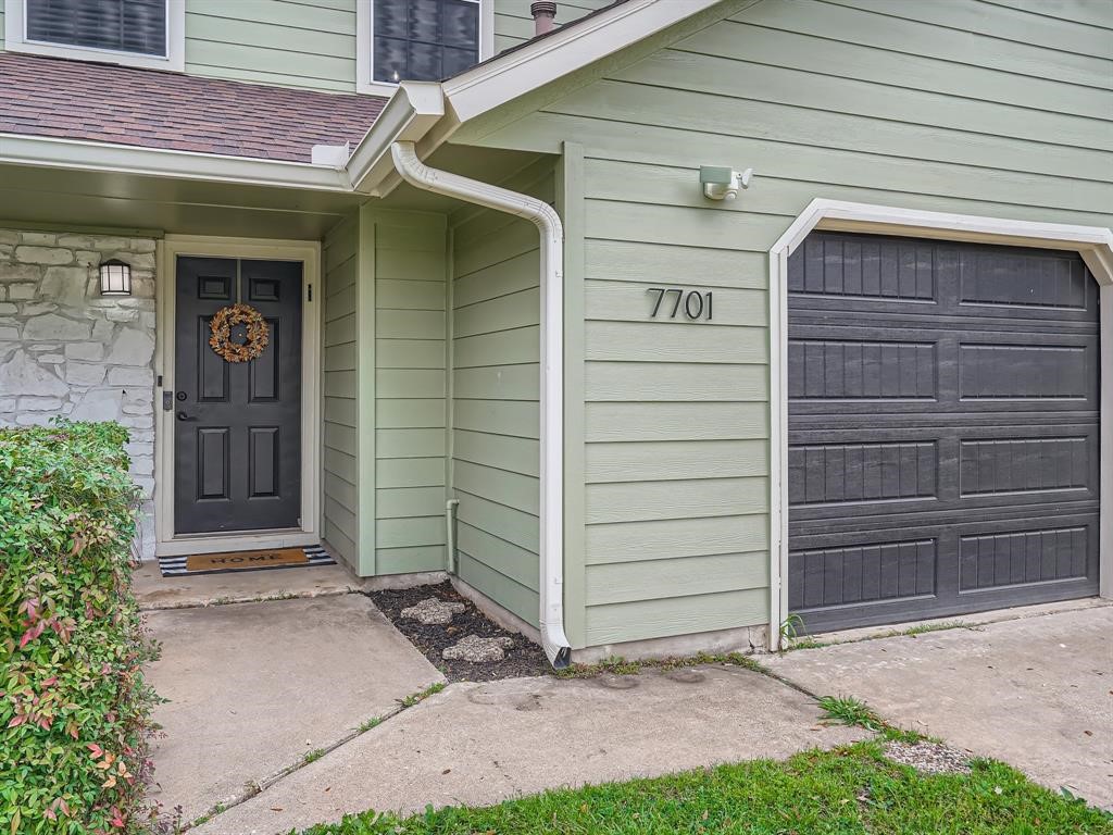 7701 Copano Drive Austin, TX 78749 - Photo 3 of 27 a front view of a house with a yard