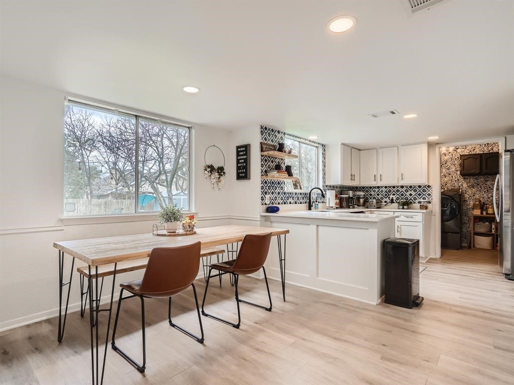 7701 Copano Drive Austin, TX 78749 - Photo 9 of 27 a kitchen with white cabinets stove and refrigerator