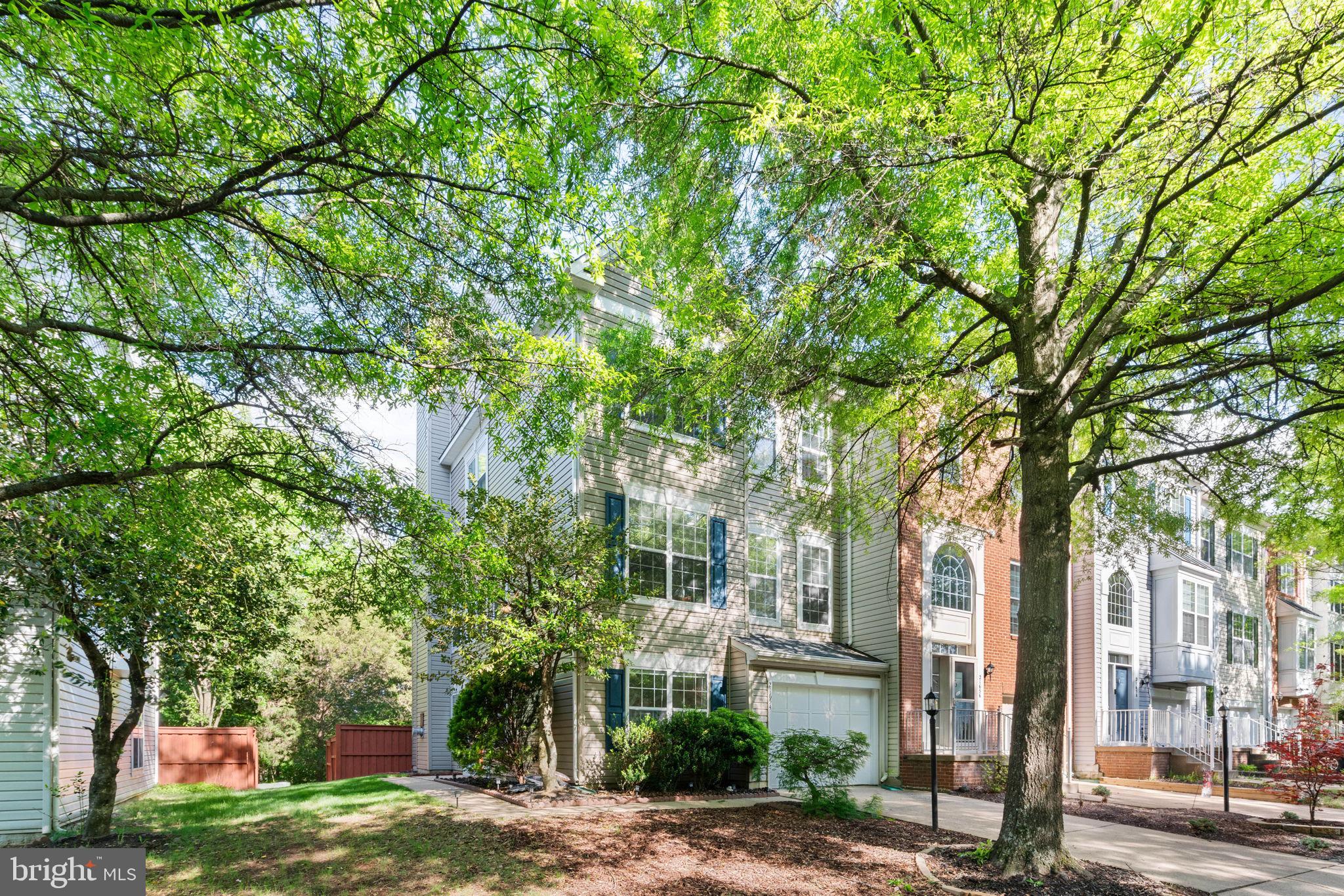 21654 Frame Square Broadlands, VA 20148 - Photo 2 of 43 Charming home embraced by lush greenery.