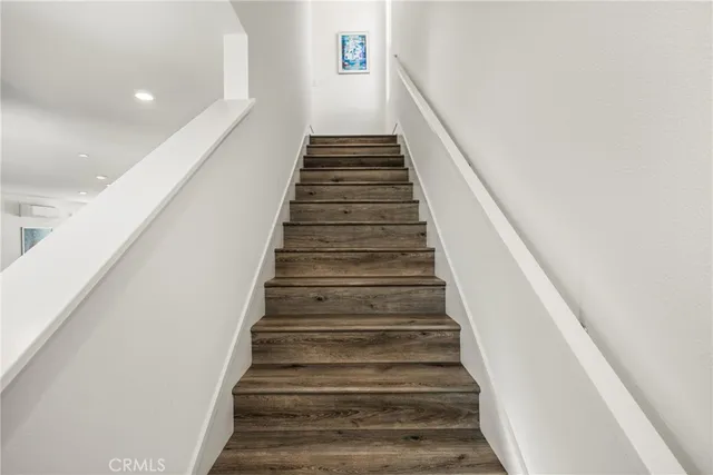 a bedroom with a bed and large window