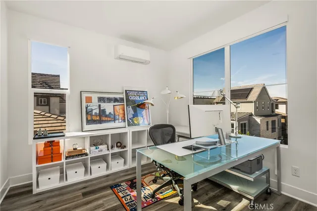 a bathroom with a granite countertop sink a toilet and a mirror