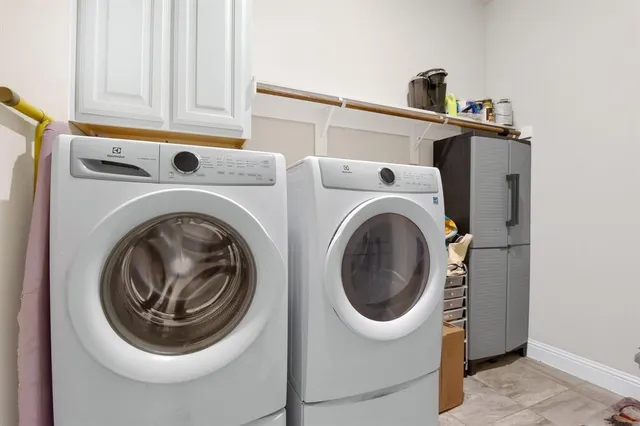 a kitchen with stainless steel appliances a refrigerator sink and cabinets