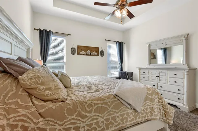 a bedroom with bed and window with lamp