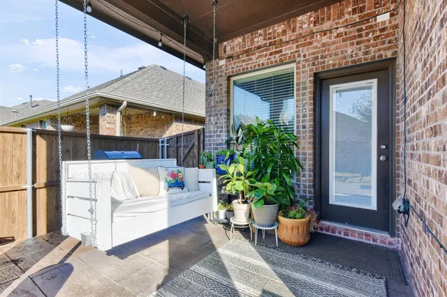 a view of patio with couches and pool