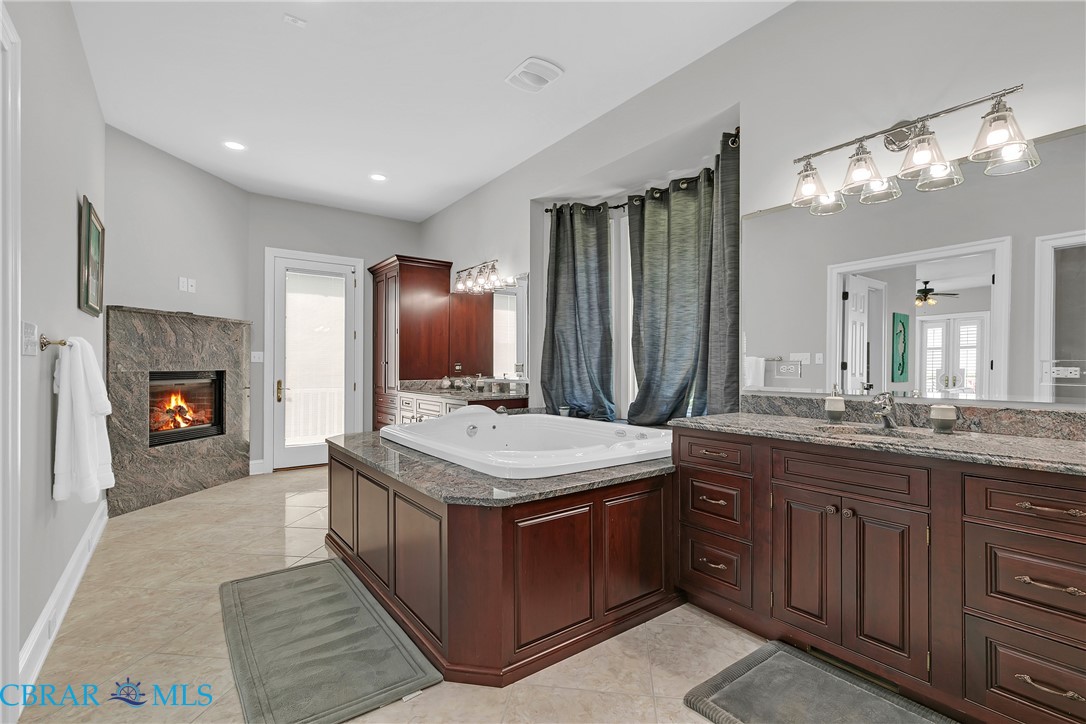 2106 Clarketown Road Heathsville, VA 22473 - Photo 22 of 56 a bathroom with a sink double vanity granite and a mirror