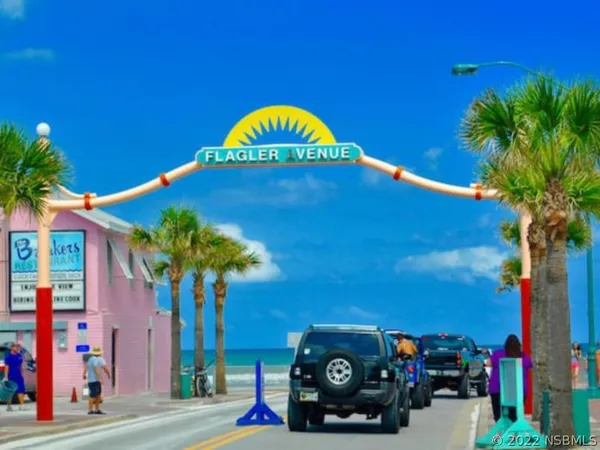 a view of a house with a cars park