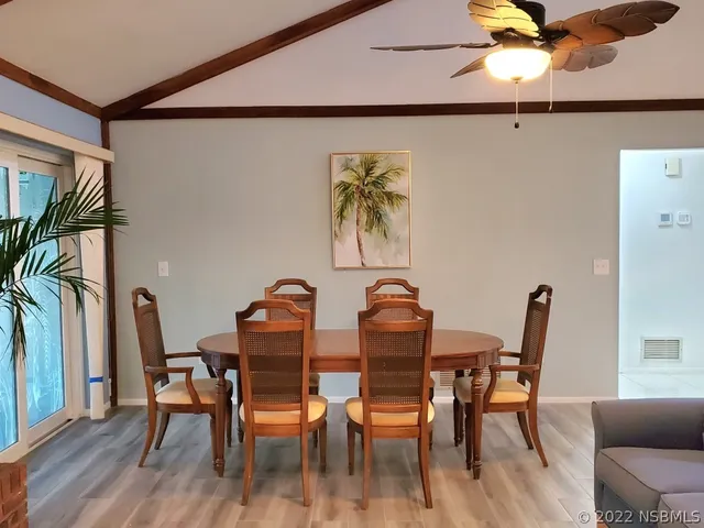 a dining room with furniture and window