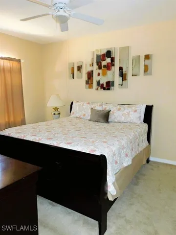 a bedroom with a bed and desk