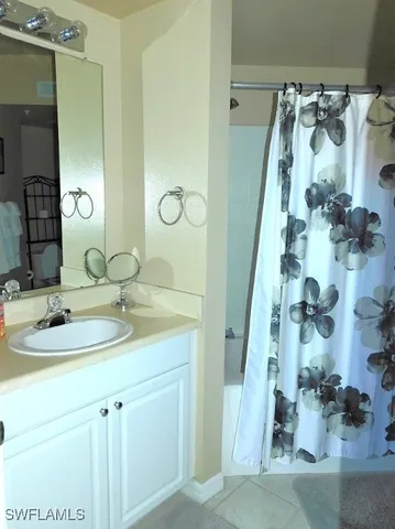 a bathroom with a sink and mirror