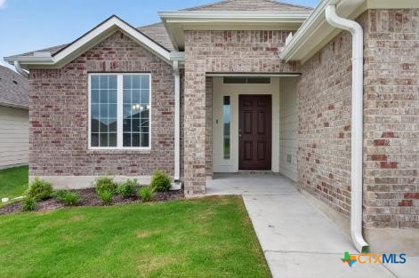 2108 Meridian Loop Temple, TX 76504 - Photo 3 of 29 a front view of a house with a yard
