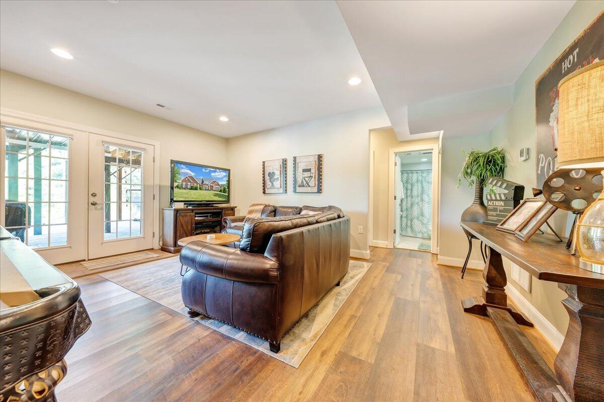 6865 Fairway Ridge Road Salem, VA 24153 - Photo 54 of 86 a living room with furniture and a flat screen tv