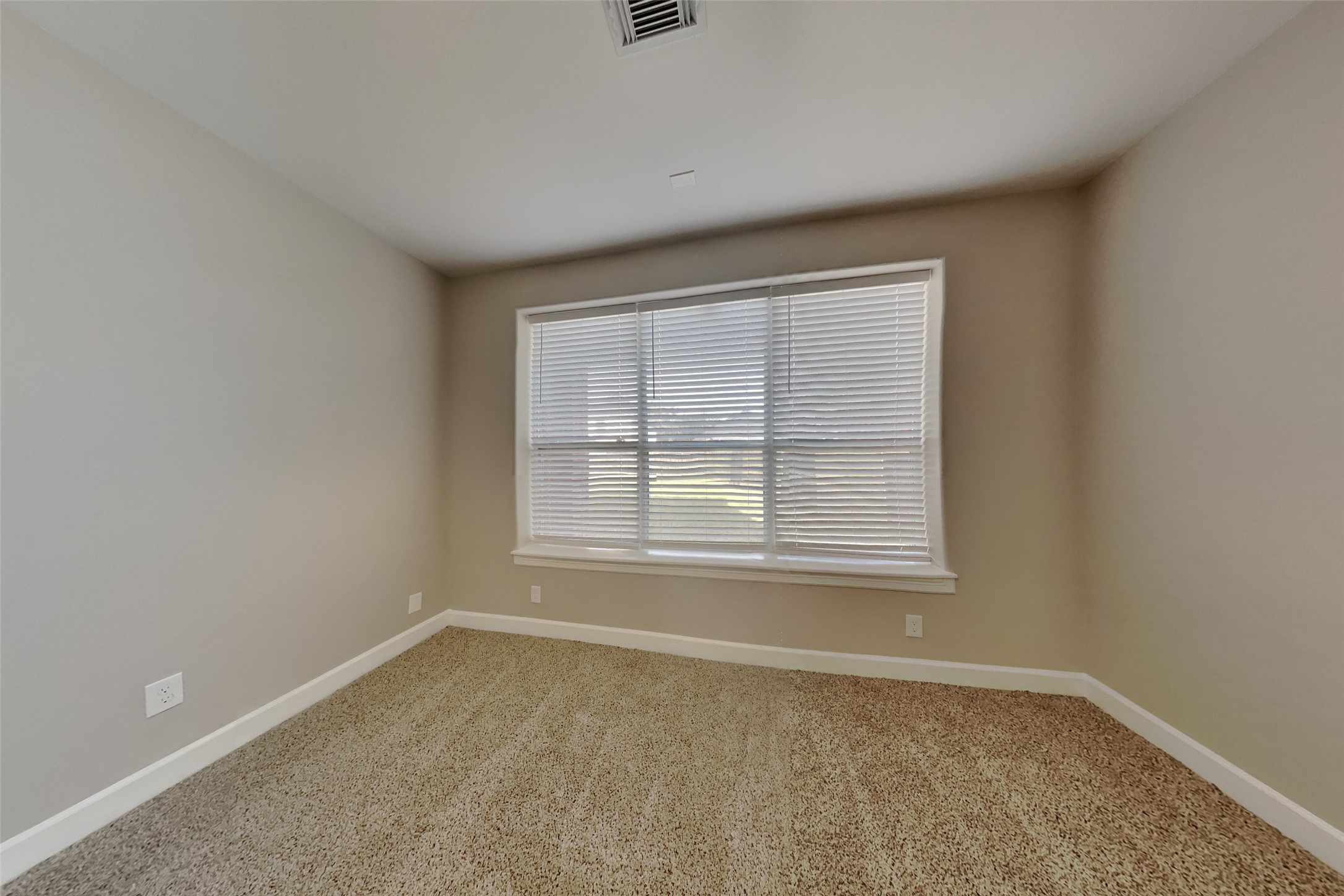 4718 Wild Bluebonnet Way Houston, TX 77084 - Photo 7 of 20 an empty room with a window