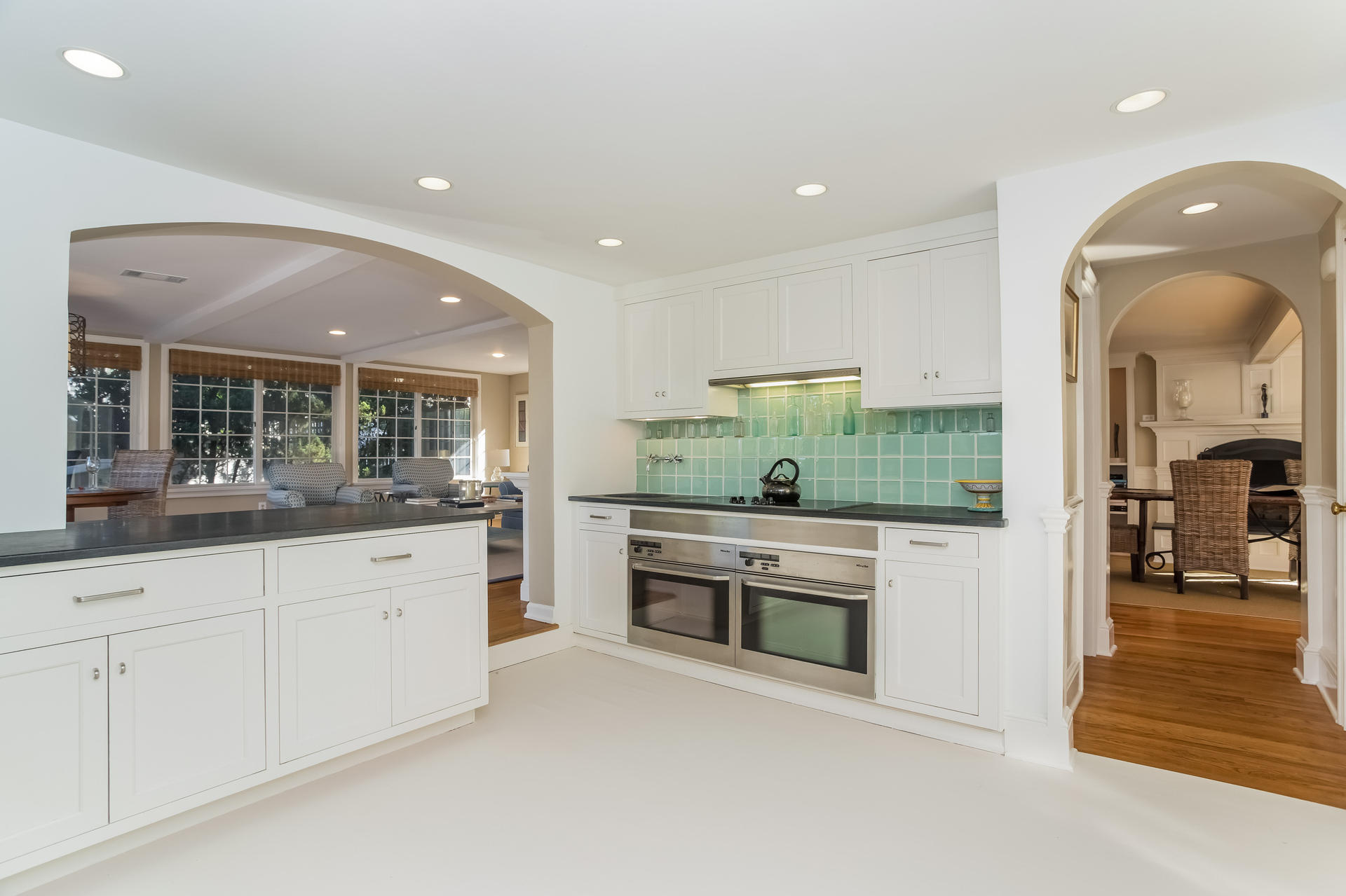 32 Nearwater Road Rowayton, CT 06853 - Photo 7 of 39 a kitchen with granite countertop white cabinets and stainless steel appliances