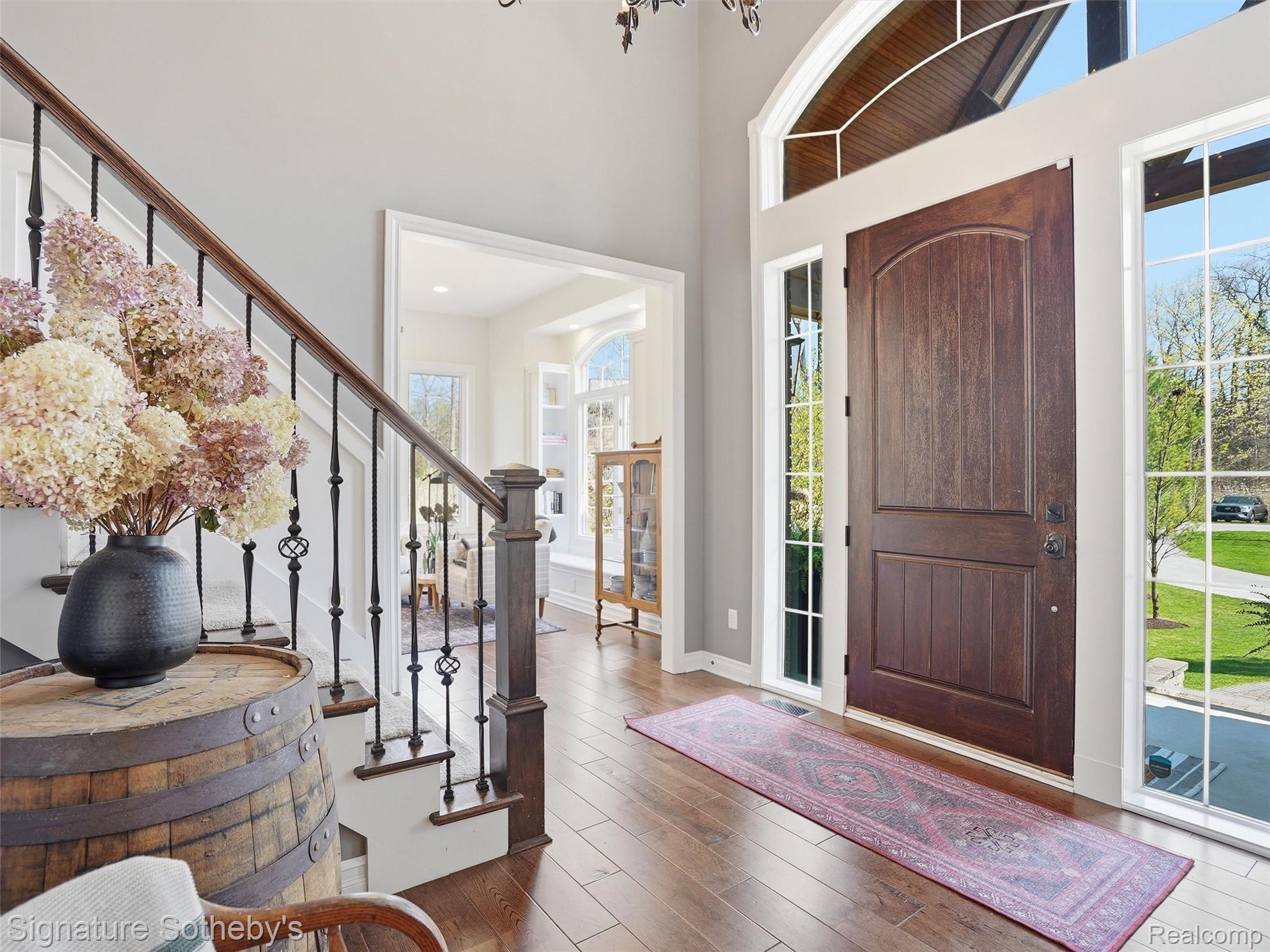 1595 Carriage Way Rochester, MI 48307 - Photo 36 of 78 Entryway featuring hardwood / wood-style floors and a high ceiling