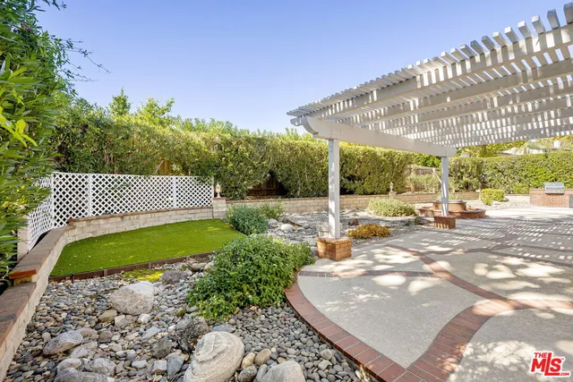 a view of a street with a bench in front of it