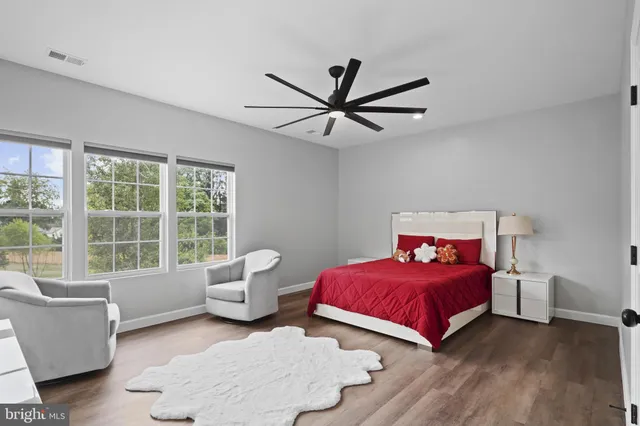 a bedroom with a bed and a couch