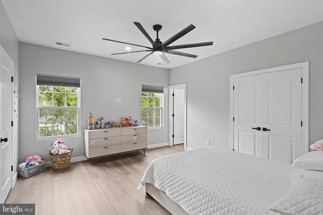 a bed room with a bed and a window