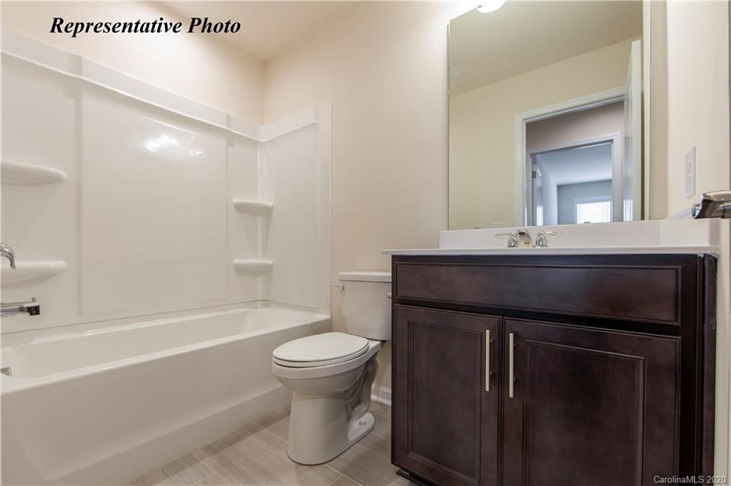 475 Hunters Dance Road, Unit 337 Fort Mill, SC 29708 - Photo 11 of 22 a bathroom with a sink a toilet and shower